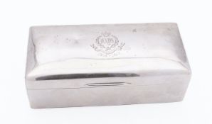 A George V silver cigarette casket by Harrods Services Ltd, London 1916,