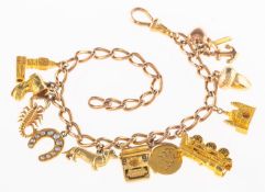 A curb link bracelet with charms, the curb link bracelet with swivel clasp, clasp marked 9 375,