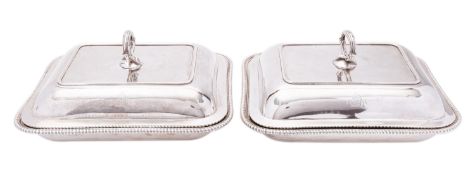 A pair of George III silver entree dishes and covers possibly by William Frisbee, London 1799,