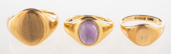 A group of three rings, including a 9ct gold signet ring, UK hallmarks, size F1/2, 2.