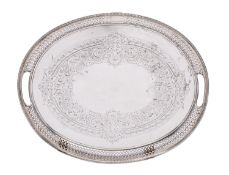 A Victorian silver drinks tray by Richard Martin & Ebenezer Hall, Sheffield 1897, of oval form,