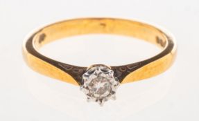 An 18ct gold diamond solitaire ring, illusion set with a small brilliant-cut diamond, UK hallmark,