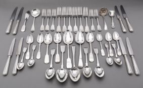 A mixed group of silver flatware including; two Victorian fiddle pattern table spoons,