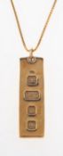 A 9ct gold ingot pendant with a chain, a 9ct gold ingot pendant, UK hallmark, length approx. 4.