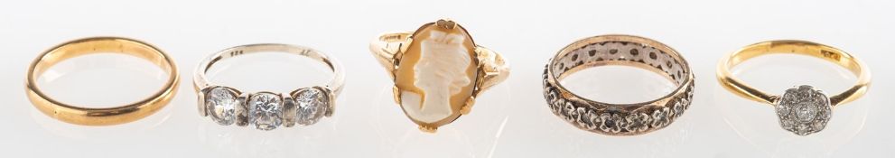 A group of five rings, including a 9ct gold cameo ring, UK hallmark, size L, 1.