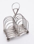 A George III silver cantilever expanding action toast rack by I.F possibly John Fuller, London 1810,