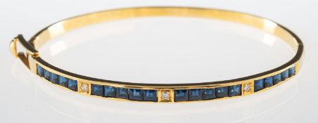 A sapphire and diamond bangle,