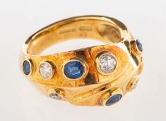 An 18ct gold sapphire and diamond ring, of modern abstract design,