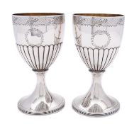 A pair of George III silver goblets by Henry Chawner and John Emmes, London 1797, part reeded,