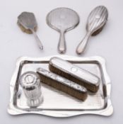 A George V silver dressing table set by Kimberley & Hewitt Ltd,