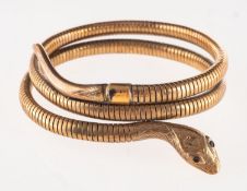Smith & Pepper. A 9ct gold snake bangle, a coiled snake bangle