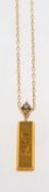 A diamond set bar pendant with chain,
