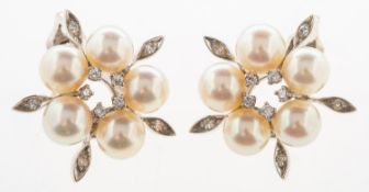A pair of cultured pearl clip-on earrings, of flowehead design, each set with five cultured pearls,