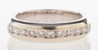 A diamond half eternity ring, channel set with eleven brilliant-cut diamonds, diamonds approx. 0.