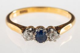 A sapphire and diamond three stone ring,