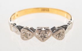 A three stone diamond heart ring,