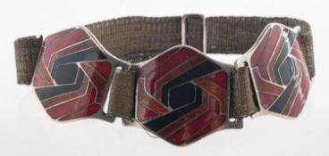 A French 1930's enamelled bracelet, comprising of three geometric panels with red,