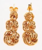 A pair of 9ct gold drop earrings, made up of three graduated articulated circular links,