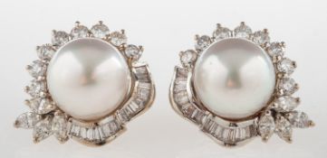 A pair of South Sea pearl and diamond earrings, each set with a South Sea pearl, measuring approx.