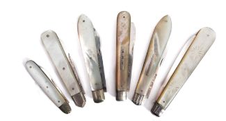 A mixed group 19th century silver and mother of pearl folding fruit knives including;
