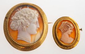Two cameo brooches, including a large cameo brooch with a Greek key designed mount, unmarked,