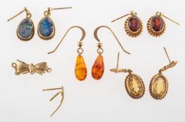 Four pairs of drop earrings, a broken earring and a necklace clasp,