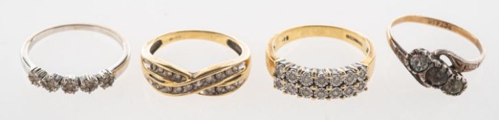 A group of four rings, including a 9ct bi-colour double row ring,