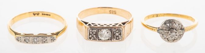 Three diamond rings, including a ring set to the centre with an old-cut diamond, diamond approx. 0.