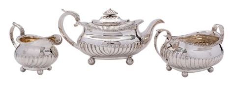 A George IV three piece silver tea service by James Wintle, London