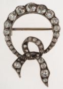 An antique diamond bow brooch, of circular bow form, set with a mixture of old-cut diamonds,