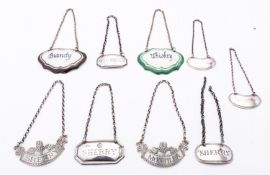 A mixed group of silver and silver plated wine labels including;