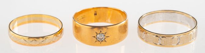 A group of three rings, including an 18ct gold band, star set with a single old-cut diamond,