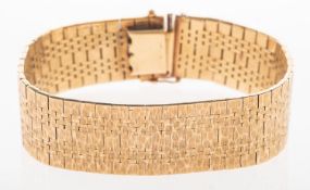 An articulated mesh bracelet, with a textured finish,