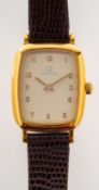 Omega De Ville a lady's gold-plated quartz wristwatch with rectangular case and dial.