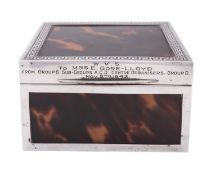 A George V silver and tortoiseshell cigarette box by Mappin & Webb, Birmingham 1927, of square form,