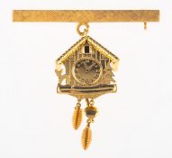 A bar brooch with cuckoo clock charm,