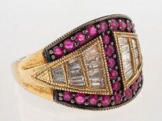 A 9ct ruby and diamond ring, a bi-colour ring,