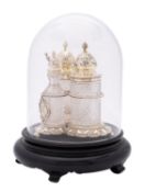 A Victorian silver-gilt and glass three-bottle spice cruet set by John William Figg, London 1872,