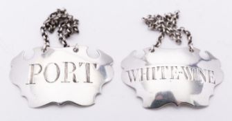 A pair of George II silver wine labels by Sandilands Drinkwater, London circa 1740,