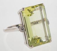 A green quartz and diamond ring, set with a rectangular-cut green quartz, approx. 25.