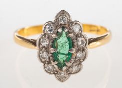 An emerald and diamond ring, of navette form and claw set to the centre with a marquise-cut emerald,