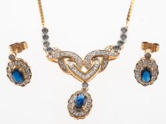 A sapphire and diamond necklace and a pair of similar earrings,