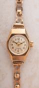 Verity a 9ct gold vintage wristwatch the round dial having raised Arabic numerals,