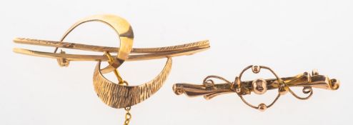 A group of two brooches,