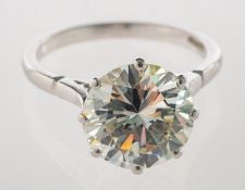 A fine and impressive diamond solitaire ring, eight claw set with a brilliant-cut diamond,