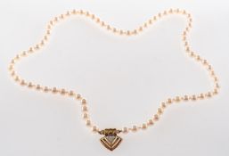 A cultured pearl necklace with a diamond set clasp, a string of 5.0mm to 5.