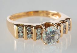 A paste and diamond set ring, claw set to the centre with a circular-cut paste stone (not diamond),