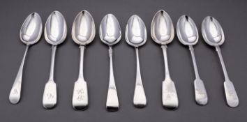 A mixed group of silver table spoons including; a pair of Fiddle pattern spoons by J.
