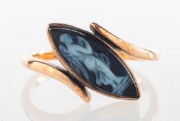 A cameo set ring, of navette form and collet set on an angle with a black carved cameo,
