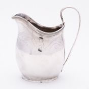 A George III silver cream jug maker's mark rubbed, London 1799, of helmet shape,
